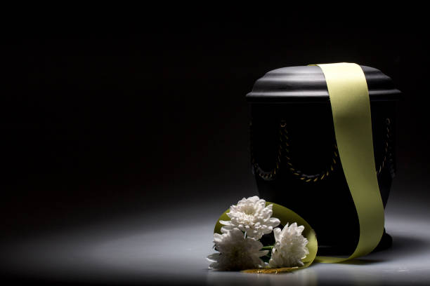 funeral mourning urn, for obituary with chrysanthemum for sympathy card funeral urn, with tape and flower decorated, for sympathy, card funerary urn stock pictures, royalty-free photos & images