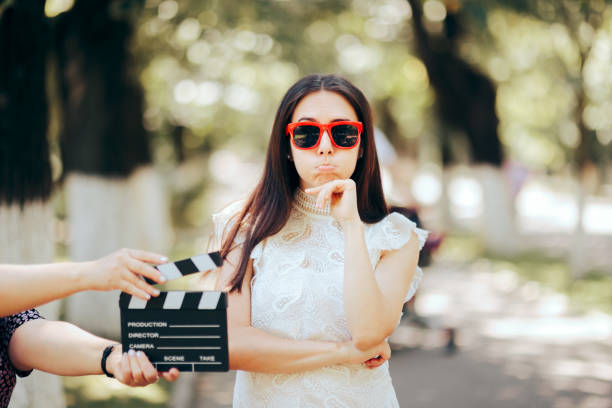 Funny Actress Forgetting her Line Filming Outdoors stock photo