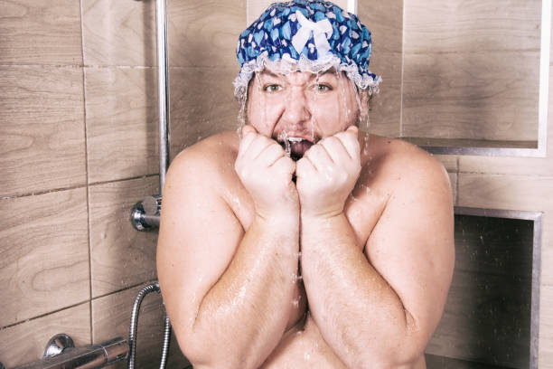 Funny fat man sings in the shower. Male care. Attractive guy. vlad model photos stock pictures, royalty-free photos & images