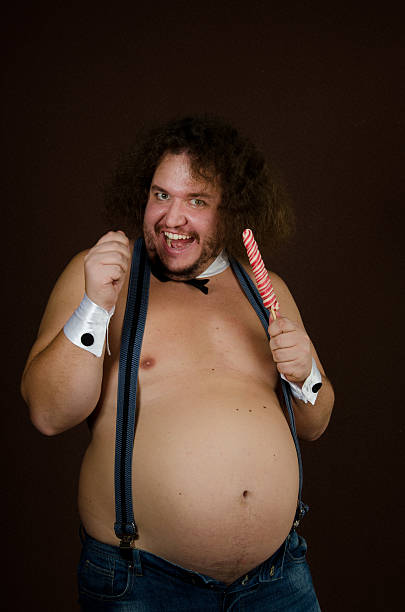 funny fat man stripper and candy. - fat man in suspenders стоковые фото и и...