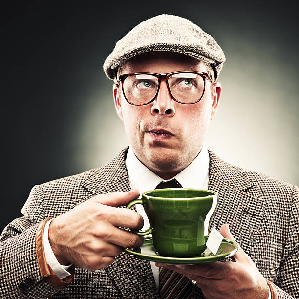 Funny man with tea Funny man with teahttp://www.fotografsatu.se/lightbox/jonas.jpg worried man funny stock pictures, royalty-free photos & images