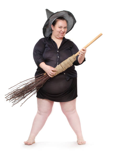 funny-obese-witch-with-her-magic-broomstick-haloween-concept-picture-id1129432273