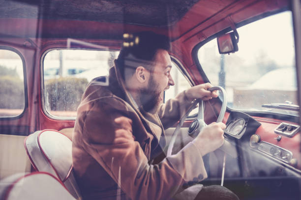 Furious Male Driving Fast with Old Style Car and Screaming Furious Male Driving Fast with Old Style Car and Screaming worried man funny stock pictures, royalty-free photos & images