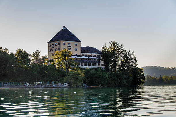 Fuschlsee in the Salzkammergut, Austria, 2015 The Fuschlsee with a building of Schloss Fuschl, a luxury collection resort and spa fuschl lake stock pictures, royalty-free photos & images