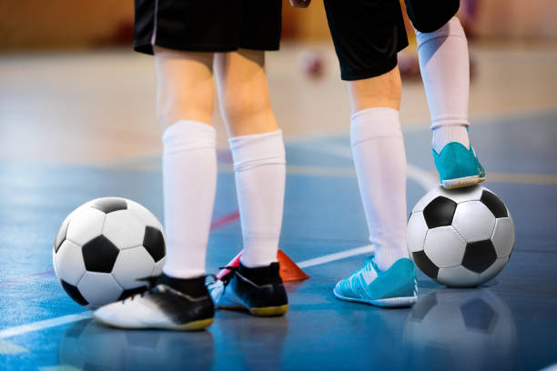 futsal soccer training. two young futsal players with balls on training. close up of legs of futsal footballers - futsal imagens e fotografias de stock