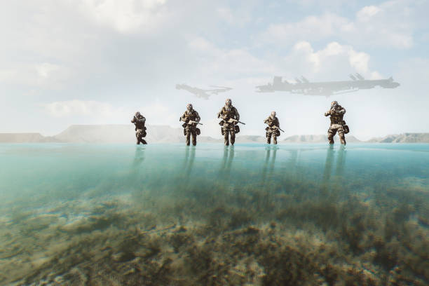 futuristic soldiers walking on the beach - beach game group stockfoto's en -beelden