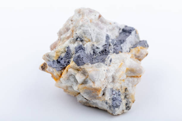 Galena rock specimen. The raw mineral lead sulphide with a distinct weight and shiny metalic colour in a white matrix of fluorite. The most important ore of lead and a source of silver.