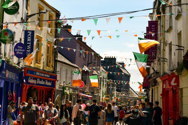 Galway Sunday afternoon on Quay St in Galway, the biggest town in the west of Ireland galway stock pictures, royalty-free photos & images