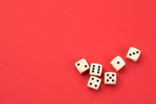 Gambling Dice’s on red background dice photos stock pictures, royalty-free photos & images