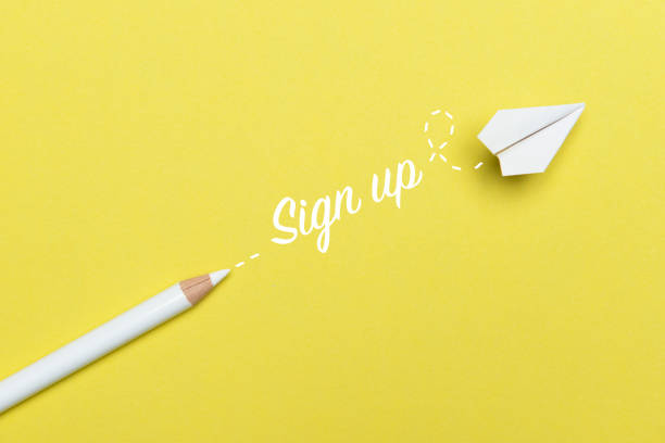 Game Changer White pencil with Sign Up text and a white paper plane on yellow background. subscription stock pictures, royalty-free photos & images