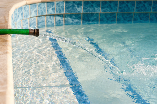 Garden Hose Filling A Swimming Pool Stock Photo - Download Image Now -  iStock