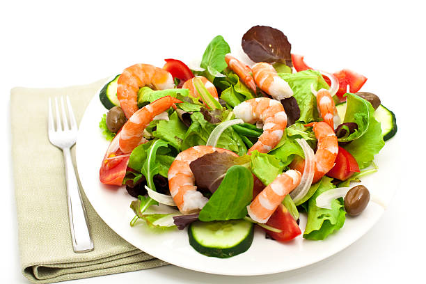 garden salad with shrimps stock photo