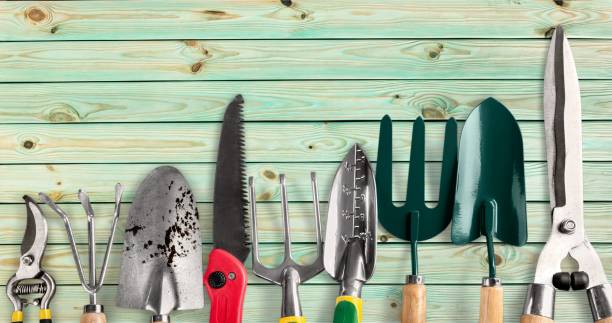Gardening. Row of gardening tools on wooden background gardening equipment stock pictures, royalty-free photos & images
