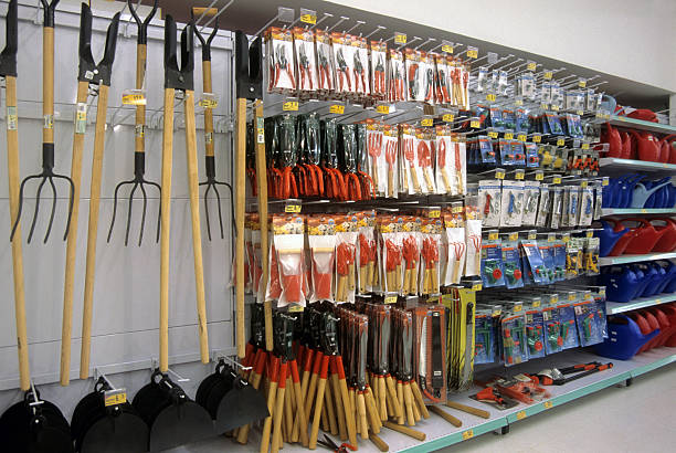 Gardening section in a supermarket Spades, pruning shears etc. All you need for your garden. gardening equipment stock pictures, royalty-free photos & images