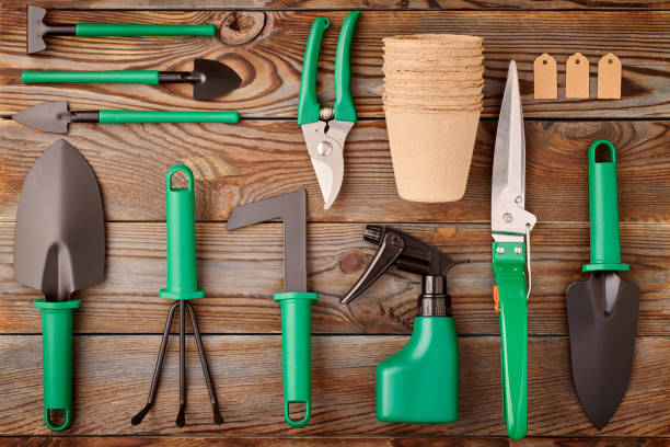 Gardening tools on wooden background flat lay Gardening tools on wooden background flat lay top view gardening equipment stock pictures, royalty-free photos & images