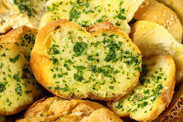 Garlic And Herb Bread Delicious homemade herb and garlic crusty bread ready to serve. garlic bread stock pictures, royalty-free photos & images