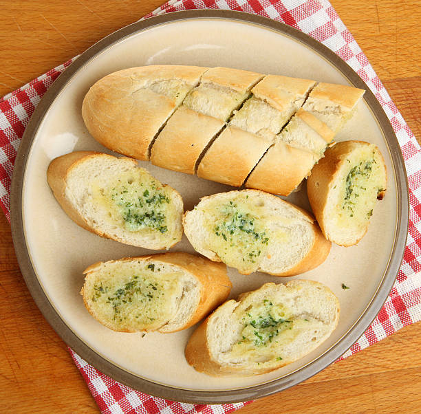 Garlic bread Baguette Baguette baked with garlic and herb butter. garlic bread stock pictures, royalty-free photos & images