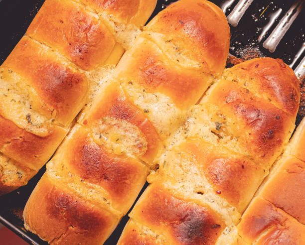 Garlic bread (roasted garlic bread). Barbecue, Brazil, Appetizers. Bread with garlic baked ( in portuguese: pão de alho ) in the oven. It is a very traditional appetizer in Brazil, where it is usually eaten grilled on the barbecue. garlic bread stock pictures, royalty-free photos & images