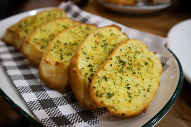 garlic bread dish, bread garlic bread dish, bread or toast dish garlic bread stock pictures, royalty-free photos & images