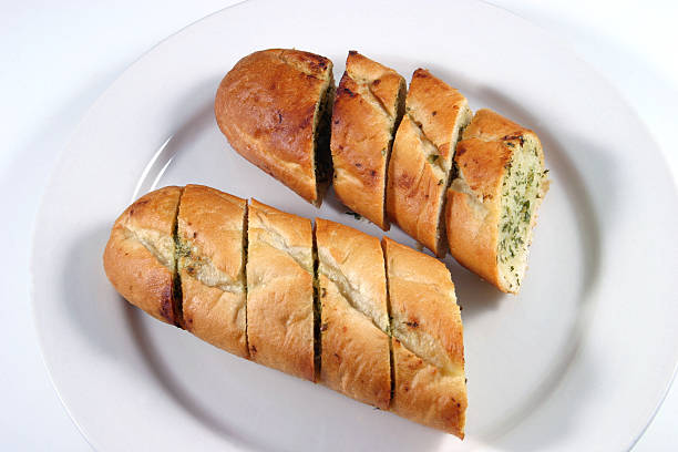 Garlic Bread Baton with garlic butter and herbs garlic bread stock pictures, royalty-free photos & images