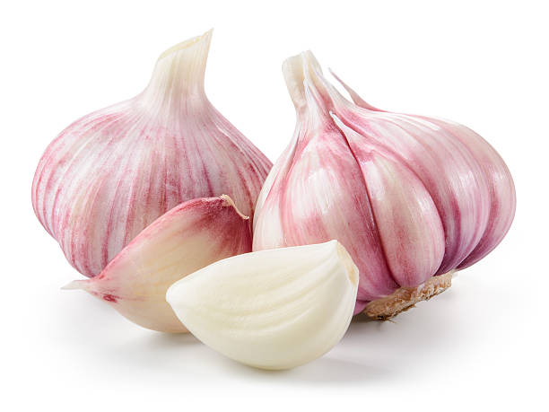 Garlic closeup isolated on white background. With clipping path. Garlic closeup isolated on white background. With clipping path. garlic photos stock pictures, royalty-free photos & images