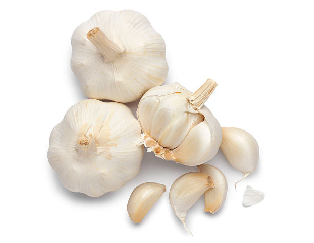 Garlic Garlic on white with soft shadow. Clipping path included. garlic stock pictures, royalty-free photos & images