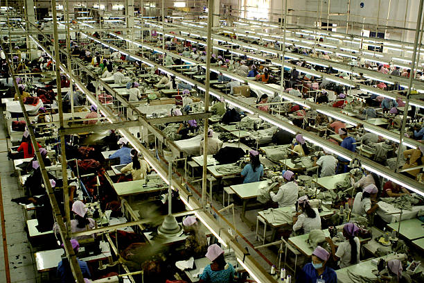 Garment Factory_1 A Garment factory in SE Asia garment stock pictures, royalty-free photos & images