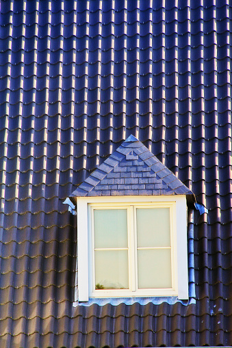 Garret window on roof house.