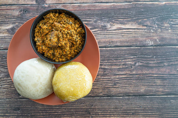 Garri and Pounded Yam served with Egusi Soup ready to eat stock photo