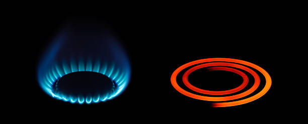 Gas and electric energy types A gas and electric cooker ring on full power camping stove stock pictures, royalty-free photos & images