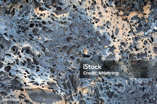 istock gas bubbles in pahoehoe lava, Craters of the Moon National Monument, Idaho 1184972126