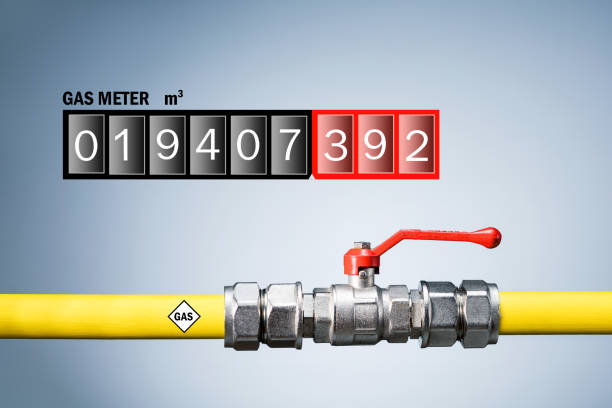 Gas meter and pipeline system on grey background. Supply of natural gas concept. stock photo