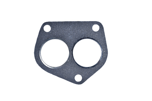 gasket automobile paronitic exhaust manifold with metal inserts auto parts on a white background close-up