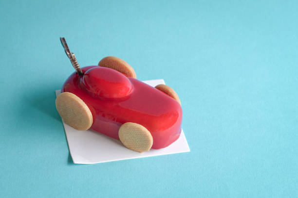 Gatou cake in the form and shape of a red sports car. stock photo