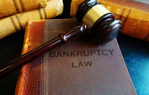 Gavel on bankruptcy Law books stock photo