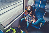 Lesbian couple traveling by train