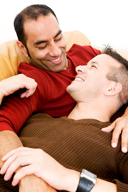 gay lifestyle: loving  gay spooning stock pictures, royalty-free photos & images