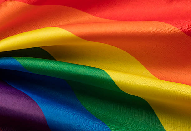 LGBT gay pride rainbow flag stock photo