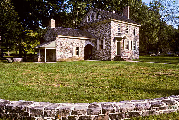 General Washington's Headquarters In December of 1777 General George Washington located his headquarters at this small house in the village of Valley Forge, Pennsylvania, USA. The General and up to 25 of his staff worked and lived in the house. Mrs. Washington also joined him there for several months of the winter. Washington's troops however were not afforded the same luxury. They endured the cold snowy winter crowded into tiny log cabins. jeff goulden scanned film stock pictures, royalty-free photos & images