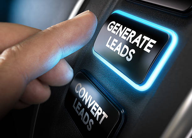 Generating and Converting Sales Leads Hand about to press a generate leads button with blue light over black background. Concept of lead management. Composite between a photography and a 3D background. Horizontal image lead stock pictures, royalty-free photos & images