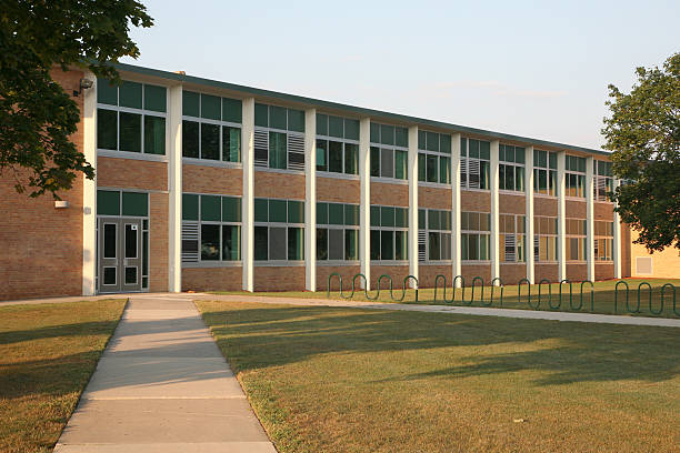 Generic school building Image of a typical middle or high school building. elementary school building stock pictures, royalty-free photos & images
