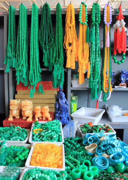 Geology shop in street market in Beijing. All kind of polished rocks and minerals being sold. Jewelry shop in Beijing. Many items to sold, necklaces, bracelets, etc. Made with amber, coral,malachite, azurite, etc. malachite stock pictures, royalty-free photos & images
