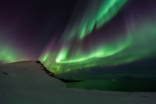 Geomagnetic Storm A powerful display of Northern Lights during a geomagnetic storm. geomagnetic storm stock pictures, royalty-free photos & images