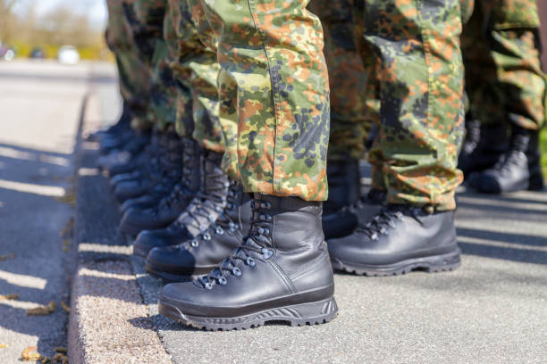 german army shoes in a line stock photo