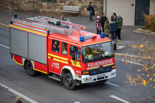 German firetruck drives to an accident in Wuerzburg, Germany. stock photo