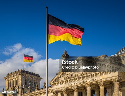 istock German flags at Reichstag, Berlin, Germany 619762776