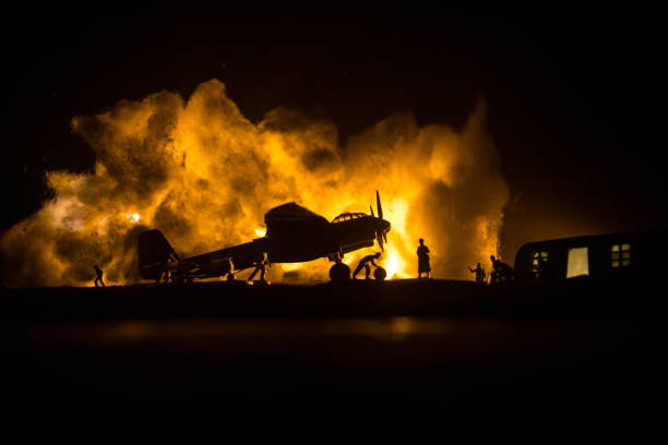 German Junker (Ju-88) night bomber at night. Artwork decoration with scale model of jet-propelled plane in possession. Toned foggy background with light. War scene. stock photo