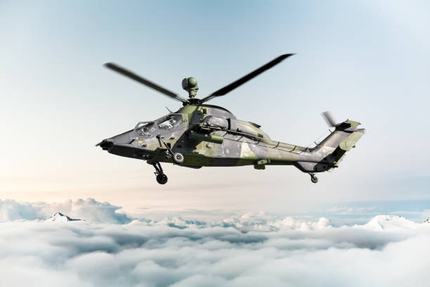 German military armed attack helicopter in flight German military armed attack helicopter in flight military helicopter stock pictures, royalty-free photos & images