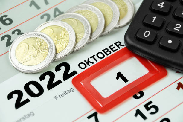 German Minimum Wage 12,00 Euro and calendar 2022 October 1 with calculator stock photo