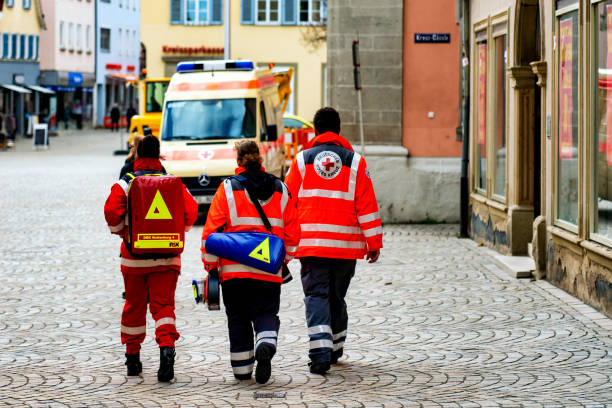 German Red Cross (Deutsches Rotes Kreuz) Medical Corps on patrol Rottenburg am Neckar, Germany, 16.03.2018: The German Red Cross, here in the city centre of Rottenburg, saves people, helps in emergencies, offers a community, supports the poor and respects international humanitarian law - in Germany and all over the world. rottenburg am neckar stock pictures, royalty-free photos & images